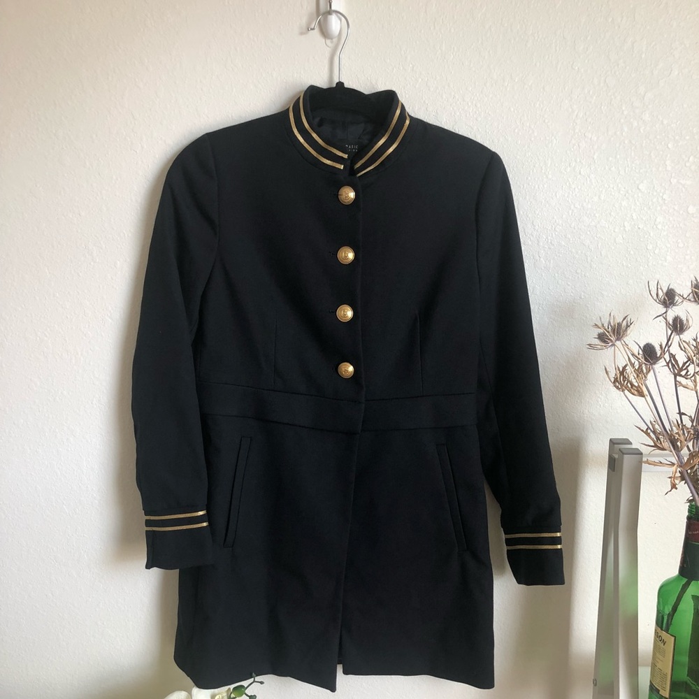 Bell boy style navy jacket w/ gold accents.